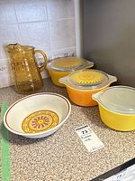 Group shot showing pitcher, three lidded Pyrex casseroles and Sahara bowl