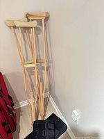 crutches leaning against wall