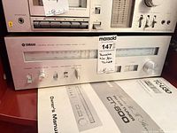 Front view of Yamaha CT-600 tuner with manual