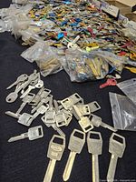 Loose and bagged uncut keys spread on table