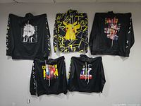 All five anime hoodies displayed on wall front side visible