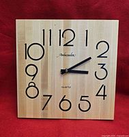 Front view of square wooden Ambassador quartz wall clock