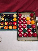 Both boxed sets side by side