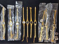 Overview of ten watches, six sealed in plastic, four loose, plus loose case backs