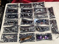 All 20 individually packaged Jianlong sunglasses laid out