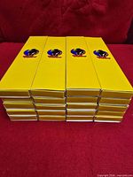 Stack of twenty yellow Dick Tracy logo boxes
