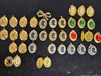 Full layout of lockets and pendant on black background