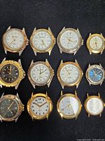 Group shot of all twelve watch heads on black background