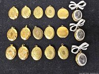 Twenty lockets arranged in four rows on black background