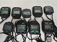Group shot of nine Marathon Adanac 3000 stopwatches showing overall quantity and condition