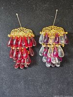 Front view of both brooches showing bead colours and design