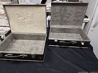 Both open cases showing interiors