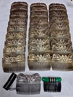 three tall stacks of gold-tone filigree combs, silver-tone comb with tag, six small side combs