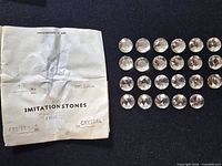 Envelope and 24 rhinestones displayed