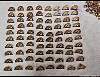 Grid of rainbow souvenir pins