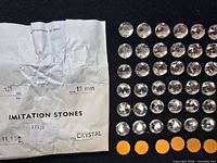 Overall view showing envelope and array of cabochons