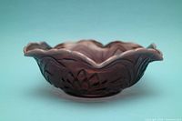 Side view showing scalloped rim and waterlily relief