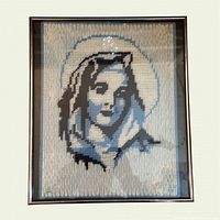 Full view of framed needlepoint portrait