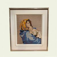 Framed needlepoint front view showing motif and frame style