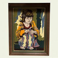 Frontal view of framed needlepoint tapestry