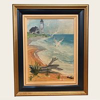 Front view of framed seascape painting