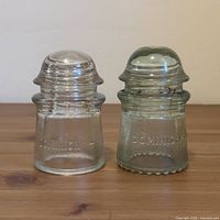 Front view of both Dominion insulators showing overall shape and clarity