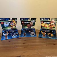 All three sealed LEGO Dimensions Fun Packs on table