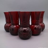Group shot of all six ruby red vases