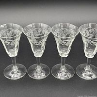All four glasses side by side, view of etched pattern and stems