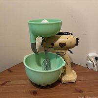 Mixer with both jadeite bowls and beaters displayed