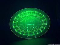 Plate fluorescing bright green under UV light