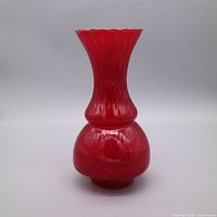 Front view of ruby red glass vase showing overall shape