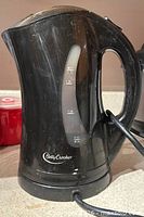 Side view showing brand logo, water-level window, scuffs