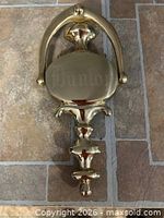 Front view of brass door knocker