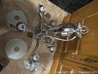 Chandelier frame with sockets and shades laid out