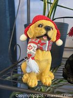 Single yellow puppy figurine close-up