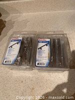 Two sealed packages of Richelieu cupboard door handles front view