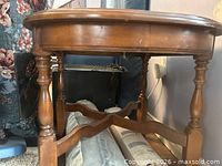 Side view showing turned legs and stretcher