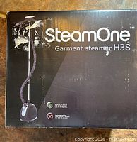 Box front showing SteamOne Garment Steamer H3S branding