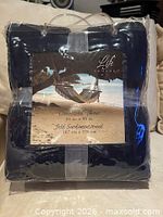 Front view of packaged Life Comfort oversized navy throw showing hammock graphic and dimensions 60 in x 90 in