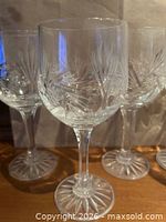 Front view of three glasses showing pinwheel etch