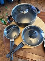 Top view of three pots with lids