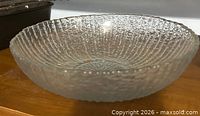 Top view of clear textured glass salad bowl showing interior ribbing and overall shape