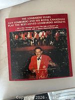 Front of red slipcase showing album title and Guy Lombardo photo