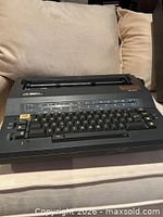 Front view of Smith Corona SE 200 electronic typewriter showing keyboard and platen