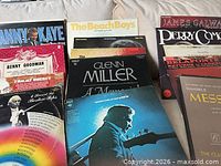 Group of LPs showing Danny Kaye, The Beach Boys, James Galway, Perry Como, Handel title, Johnny Cash, Glenn Miller, Bing Crosby.