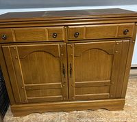 Front view of wooden cabinet closed