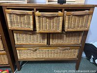 Front view of dresser with all six wicker basket drawers in place