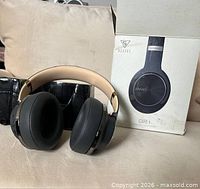 Headphones in front of box
