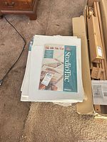 Stack of Bainbridge StudioTac pad on top of shrink-wrapped canvases and other pads